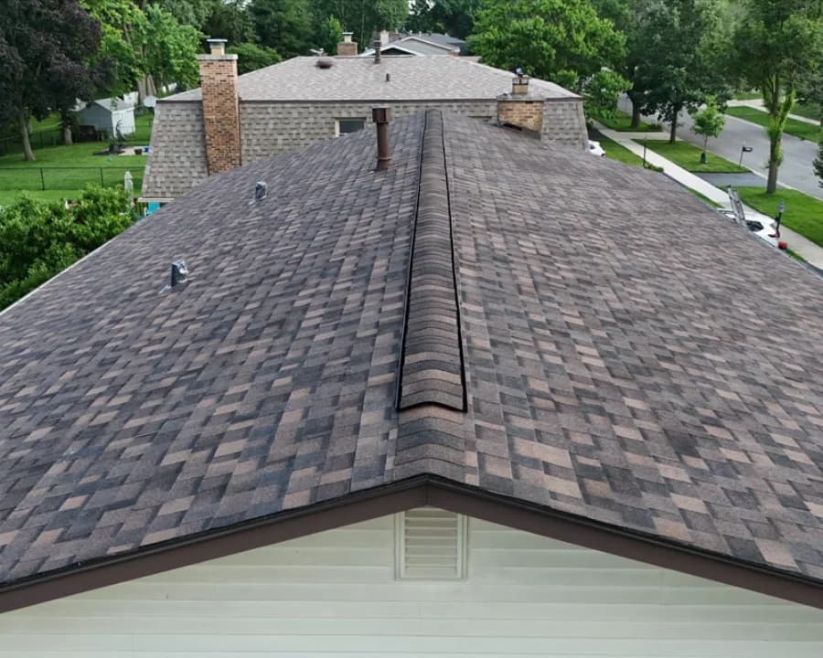 Local home with worn shingles after replacement