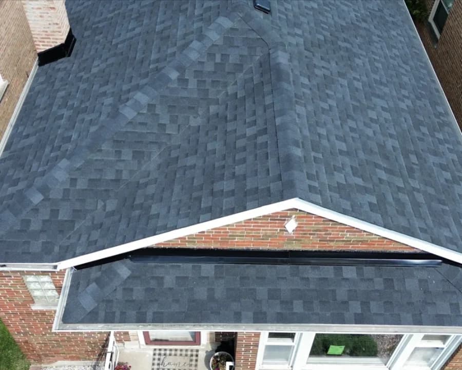 Local home with repeatedly patched shingles after replacement
