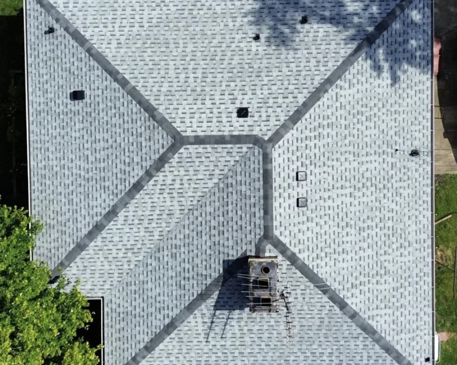 Local home with sun-faded shingles after replacement